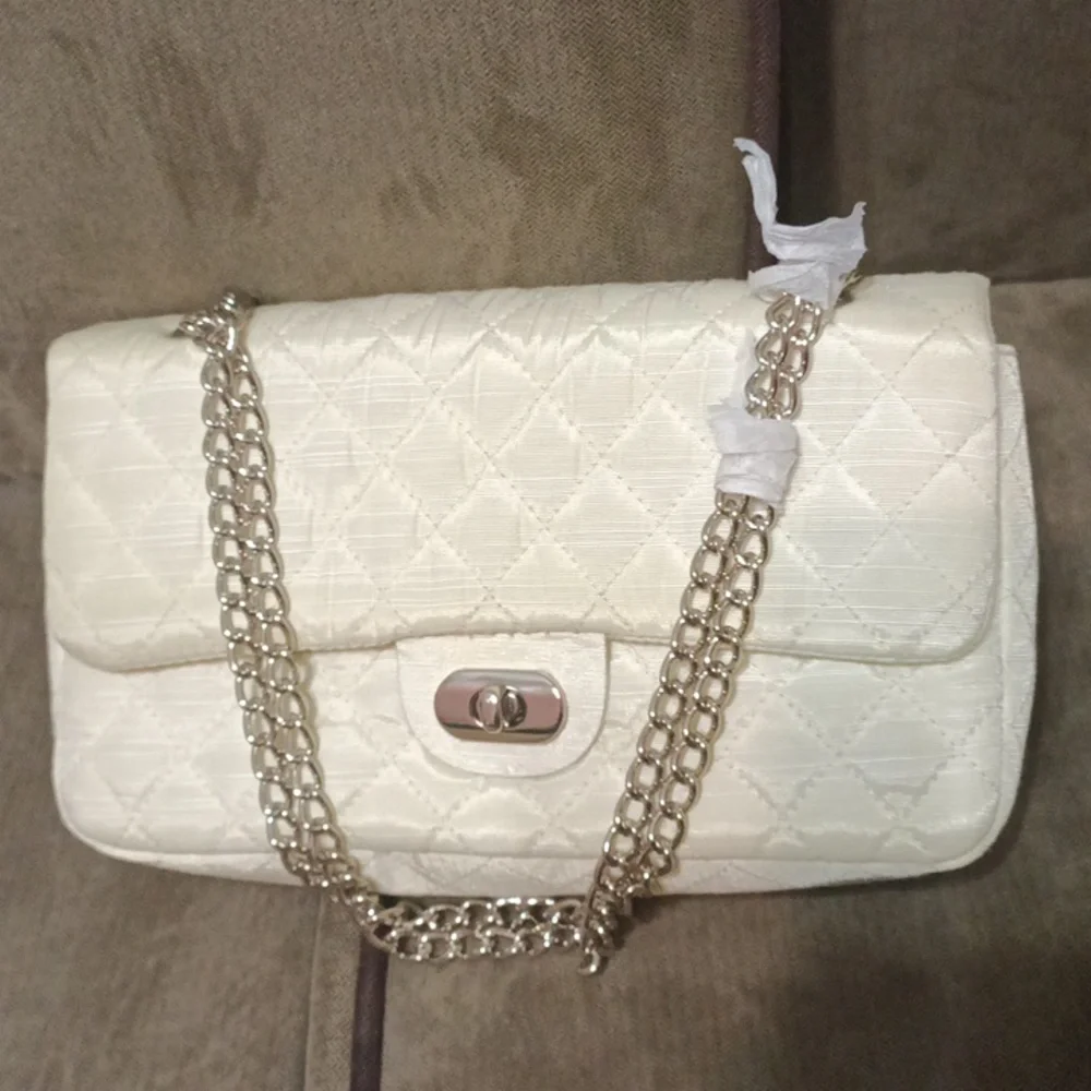 Newport news quilted chained clutch shoulder bag new never used off white.